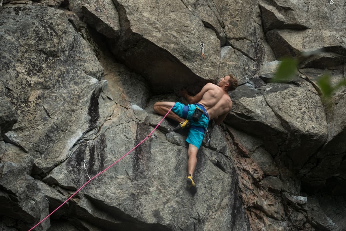Climber working through a structured training session on an indoor wall.